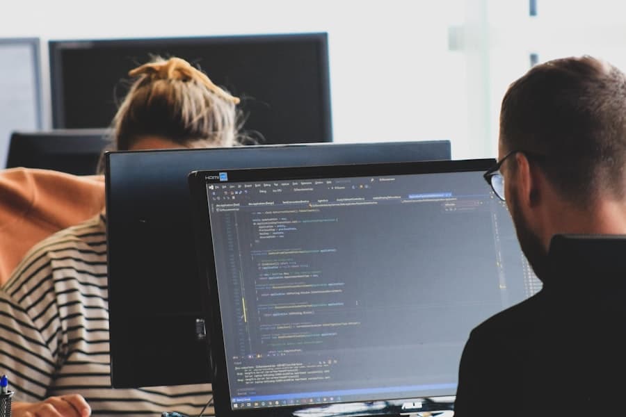 Two engineers reviewing code together