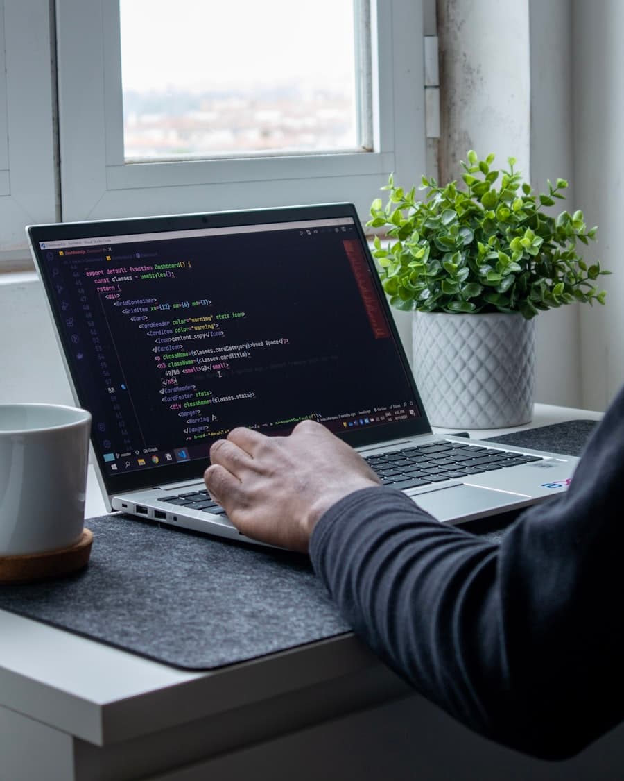 Hands on a laptop keyboard with an editor open